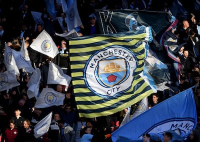 Manchester City fans wave flags prior to the Carabao Cup Final game against Aston Villa at Wembley Stadium on March 1, 2020 in London, England. Michael Regan / Getty