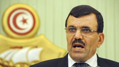 Ali Larayedh, Tunisia's prime minister, unveils a new coalition government on Friday. Hassene Dridi / AP Photo