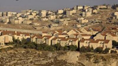 The Jewish neighborhood of Pisgat Zeev in east Jerusalem, with the Shuafat refugee camp in the background and Israel's separation barrier running between them.