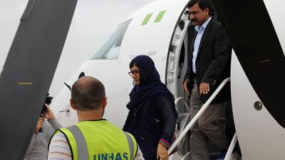 Malala arrives at Maiduguri airport in Borno, Nigeria, with her father Ziauddin Yousafzai. Afolabi Sotunde