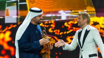Al Jassmi receives the award for Best Middle East Artist from Nikolay Baskov at the Bravo awards in Moscow. Photo: DCT Abu Dhabi