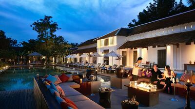 Fireplace by the pool. Courtesy Sofitel Luang Prabang