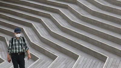 A man wearing face masks to protect against the spread of the new coronavirus walk at pier of Yokohama, near Tokyo. AP Photo