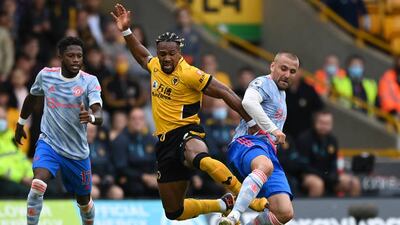 Wolves' Adama Traore battles for possession with Luke Shaw of Manchester United. Getty