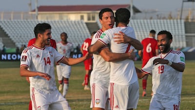 UAE's Ali Mabkhout celebrates with his teammates after scoring. AFP