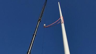 The Trident Support team work on assembling one of the two 120-metre flagpoles.