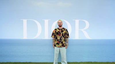 Colombian singer J Balvin attends the Dior Homme photocall. Getty Images For Christian Dior