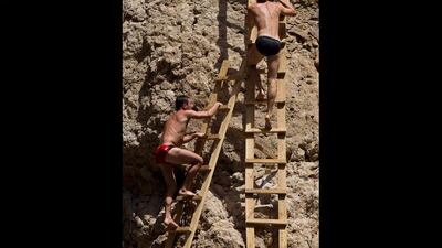 Winner of the Red Bull Cliff Diving World Series 2012, Gary Hunt, leads the climb back to the board.