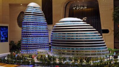 A model of the Meiquan 22nd Century building in China's southwest Chongqing. The set of towers looks uncannily like ones designed by renowned architect Zaha Hadid. AFP Photo
