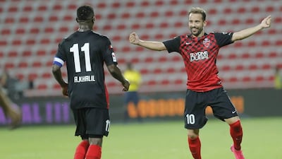 Everton Ribeiro, right, set up Ahmed Khalil's goal to secure a 1-0 win against Al Ain. Hasan Alraesi / Al Ittihad
