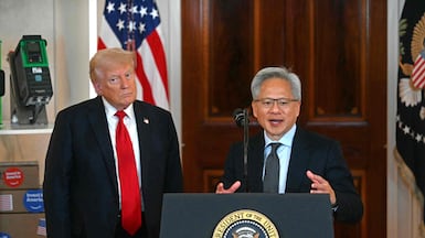 Nvidia chief executive Jensen Huang with US President Donald Trump in the White House on December 9. AFP