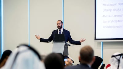 Walid Faza, partner at Wamda Capital, addressing the audience while sharing the key findings of the report. Leslie Pableo for The National
