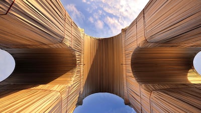 The silver blue cloth encasing the Arc de Triomphe turned gold in the setting sun. AFP