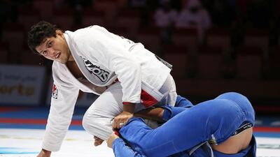 Felipe Pena, left, during his win against Helton Junior in qualifying for the 94kg main draw at the Abu Dhabi World Professional Jiu-Jitsu Championship. Pawan Singh / The National