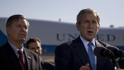 Alongside George W Bush, US president at the time, in 2007. AFP