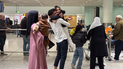 People greet their family members arriving from a commercial flight from Beirut at Heathrow Airport in London. EPA