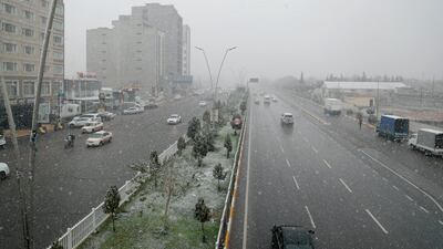 Snow fills the air in Erbil. AP Photo