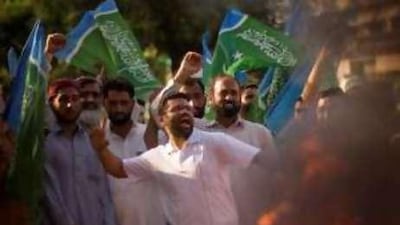 Supporters of Pakistan's largest Islamic political group, Jamaat-e-Islami, shout slogans against Pervez Musharraf in Islamabad yesterday.