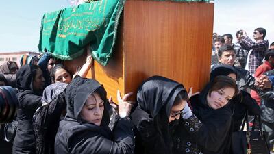 Afghan women's rights activists carry the coffin of 27-year-old Farkhunda, an Afghan woman who was beaten to death by a mob, during her funeral in Kabul, Afghanistan on March 22, 2015. Hundreds of people gathered in northern Kabul for the funeral of Farkhunda who was killed on Thursday by a mob. Massoud Hossaini/AP Photo