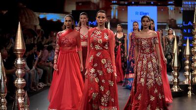 Designer Nachiket Barve works with bridal shades of red for his collection. AFP