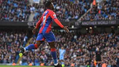 Wilfried Zaha celebrates after scoring the opening goal . AFP