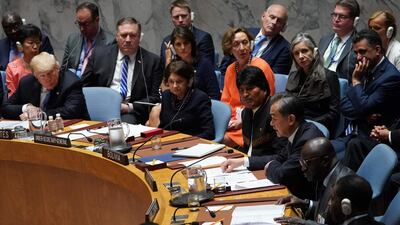 US President Donald Trump "listens" as Chinese Foreign Minister Wang Yi speaks during the United Nations Security Council briefing at the United Nations. AFP