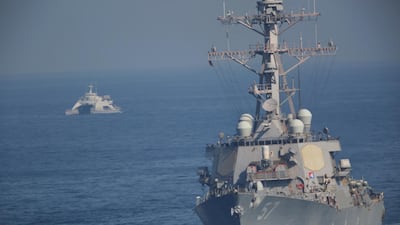 Iran's Revolutionary Guard use an abandoned warship as a target during exercises in the Arabian Gulf. AP