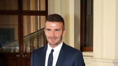 David Beckham, in navy suiting, attends the Queen's Young Leaders Award ceremony at Buckingham Palace on June 26, 2018 in London, England. Getty Images