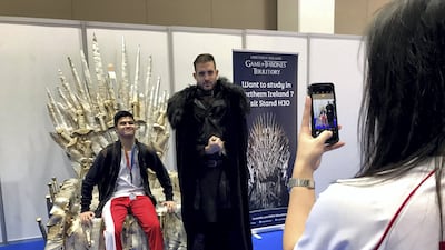 Sean Steven, 16, poses for a photo on a replica Game of Thrones chair at the Northern Ireland booth at Najah education fair on Wednesday. Roberta Pennington / The National