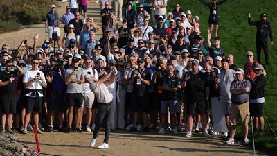 Rory McIlroy plays his third shot on the 14th hole, on day one of the Hero Dubai Desert Classic. Getty Images