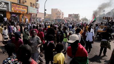 People chant slogans during a protest to denounce the coup. AP