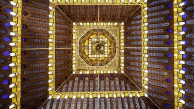 A giant chandelier hangs in the middle