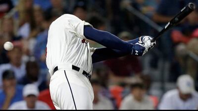 Freddie Freeman of the Atlanta Braves swings for a strike in the fourth inning of a baseball game against the New York Mets in Atlanta. David Goldman / AP Photo