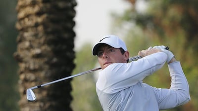 Rory McIlroy of Northern Ireland plays his third shot during the first round of the 2016 Dubai Desert Classic at the Emirates Golf Club on February 4, 2016 in Dubai. / AFP / KARIM SAHIB