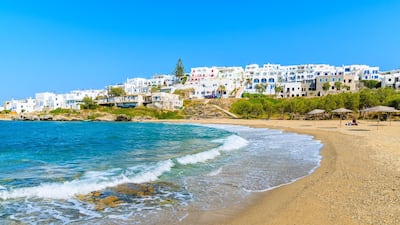 A beach in Noussa town on the Greek island of Paros, where holiday time beckons. Alamy