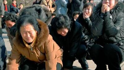 North Korean women cry after learning death of their leader Kim Jong-il.