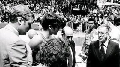 W With the game on the line UCLA basketball players huddle around their coach, the legendary leader John Wooden. This game at Notre Dame, a 71-70 loss on January 19, 1974, ended the Bruins' 88-game winning streak, but the team would go on to win a 10th national championship one year later. AP Photo