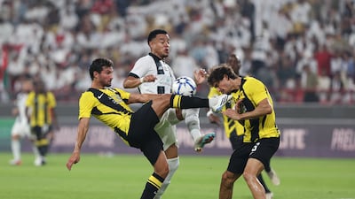 Al Jazira's Bruno battles with Al Ittihad's Faris Abdi, right, and Houssem Aouar during the AFC Champions League Elite Qualification match at Mohammed bin Zayed Stadium, Abu Dhabi. All photos: Chris Whiteoak / The National