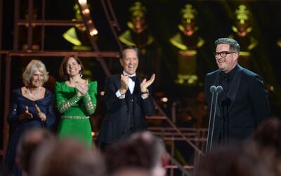 LONDON, ENGLAND - APRIL 07: (L-R) Camilla, Duchess of Cornwall, Darcey Bussell and Richard E. Grant present the Special Award to Matthew Bourne on stage during The Olivier Awards 2019 with Mastercard at the Royal Albert Hall on April 07, 2019 in London, England. (Photo by Jeff Spicer/Getty Images)