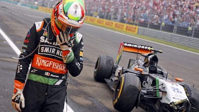 Force India Formula One driver Sergio Perez of Mexico reacts after a crash during the Hungarian F1 Grand Prix at the Hungaroring circuit, near Budapest July 27, 2014. REUTERS/Darko Bandic
