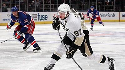 Pittsburgh's Sidney Crosby shoots against the New York Rangers on Thursday night.