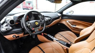 The driver-centric dash features a mix of traditional switchgear and digital displays