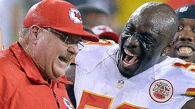 It has been all smiles for coach Andy Reid, left, celebrating a win over Philadelphia Eagles with this linebacker, Justin Houston, to send the Kansas City Chiefs to 3-0 on the season. John Sleezer / Getty Images