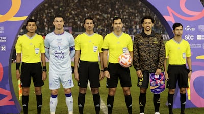 Cristiano Ronaldo and PSG's Marquinhos with officials before the match. Reuters