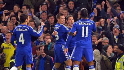 Chelsea's Eden Hazard, second right, celebrates with teammates Didier Drogba, right, Cesar Azpilicueta, second left, and Cesc Fabregas, left, after scoring the opener in Chelsea's 3-0 win over Tottenham on Wednesday in the Premier League at Stamford Bridge. Glyn Kirk / AFP
