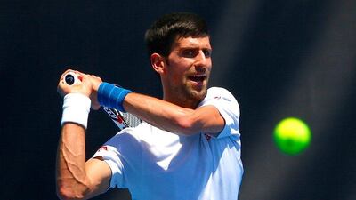 Novak Djokovic hits a backhand during a training session. David Gray / Reuters