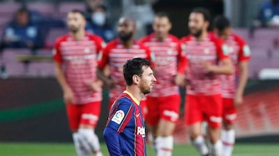 Barcelona's Lionel Messi looks dejected after Jorge Molina scored Granada's winning goal in their 2-1 La Liga victory on Thursday, April 29. Reuters