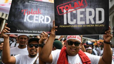 Protesters display placards reading "No To Icerd" during a rally organised by Muslim politicians against the signing of the UN anti-discrimination convention (ICERD) at Merdeka Square in Kuala Lumpur. AFP
