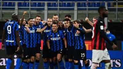 Inter Milan players celebrate after Danish midfielder Christian Eriksen scored the winning goal from an injury-time free-kick as they beat city rivals Inter in the Coppa Italia quarter-final tie on Tuesday, January 26. AFP