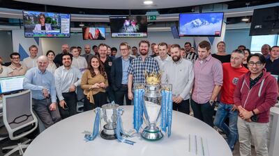 The Premier League trophy and Carabao Cup visit The National newsroom. All photos by Victor Besa/The National